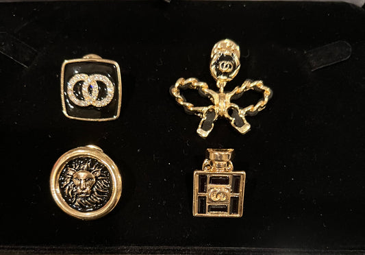Black/ gold metal lion 4 piece brooch pin set.