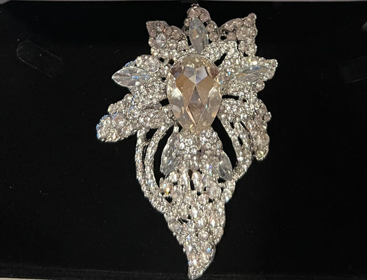 Silver tone crystal pave bouquet brooch.