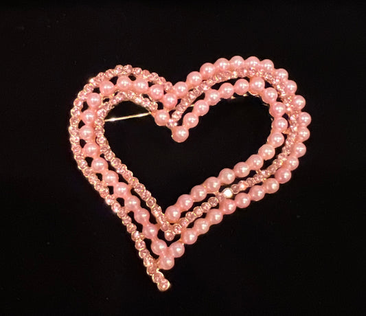 Pink heart brooch with pink pearls and pink rhinestones.