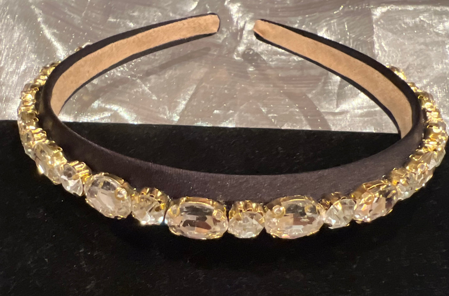 Black headband with silver rhinestones.