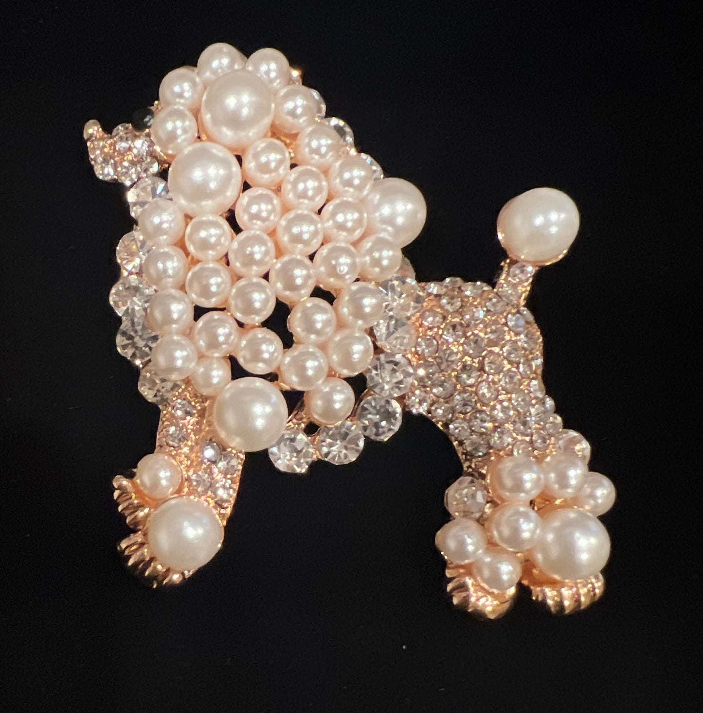 White pearl/rhinestone poodle brooch w/ gold tone trim.