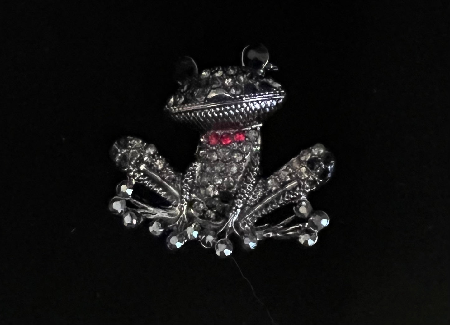 Dark silver tone frog with rhinestones.