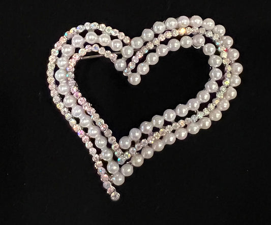 Silver tone brooch with pearls and tricolor rhinestones.