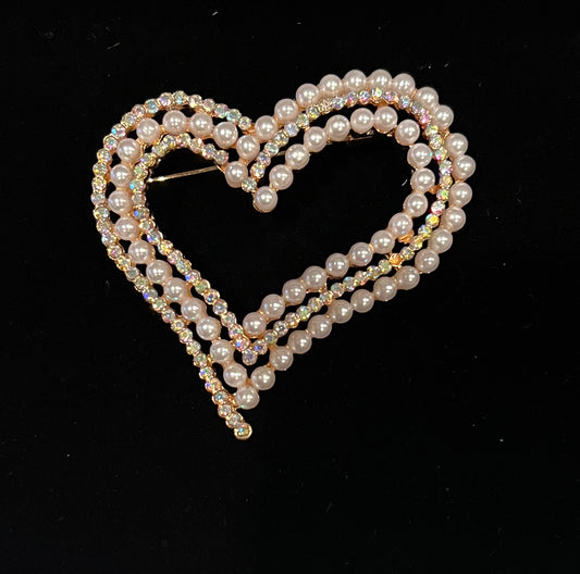 Gold tone brooch with pearls and rhinestones.