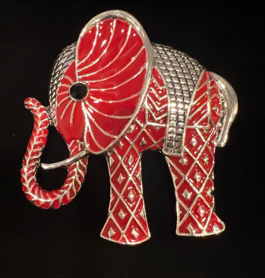 Tall standing red and silver tone elephant brooch.