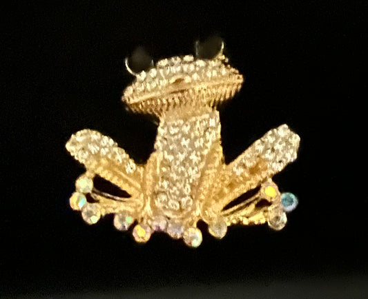 Gold tone rhinestone frog.