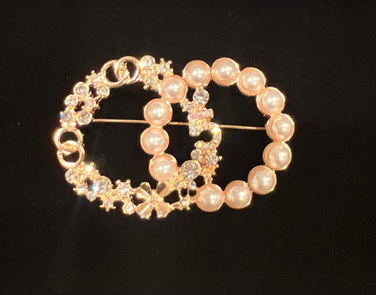 Gold and Pearl double o brooch.