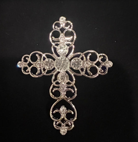 Silver tone cross with rhinestones.