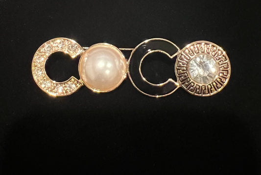 CO brooch with rhinestone and pearls brooch in gold tone.