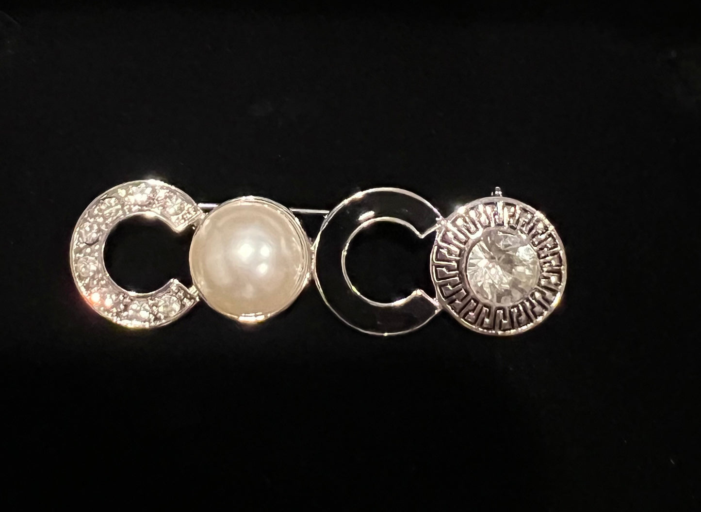 CO brooch with rhinestones & faux pearls in silver tone.