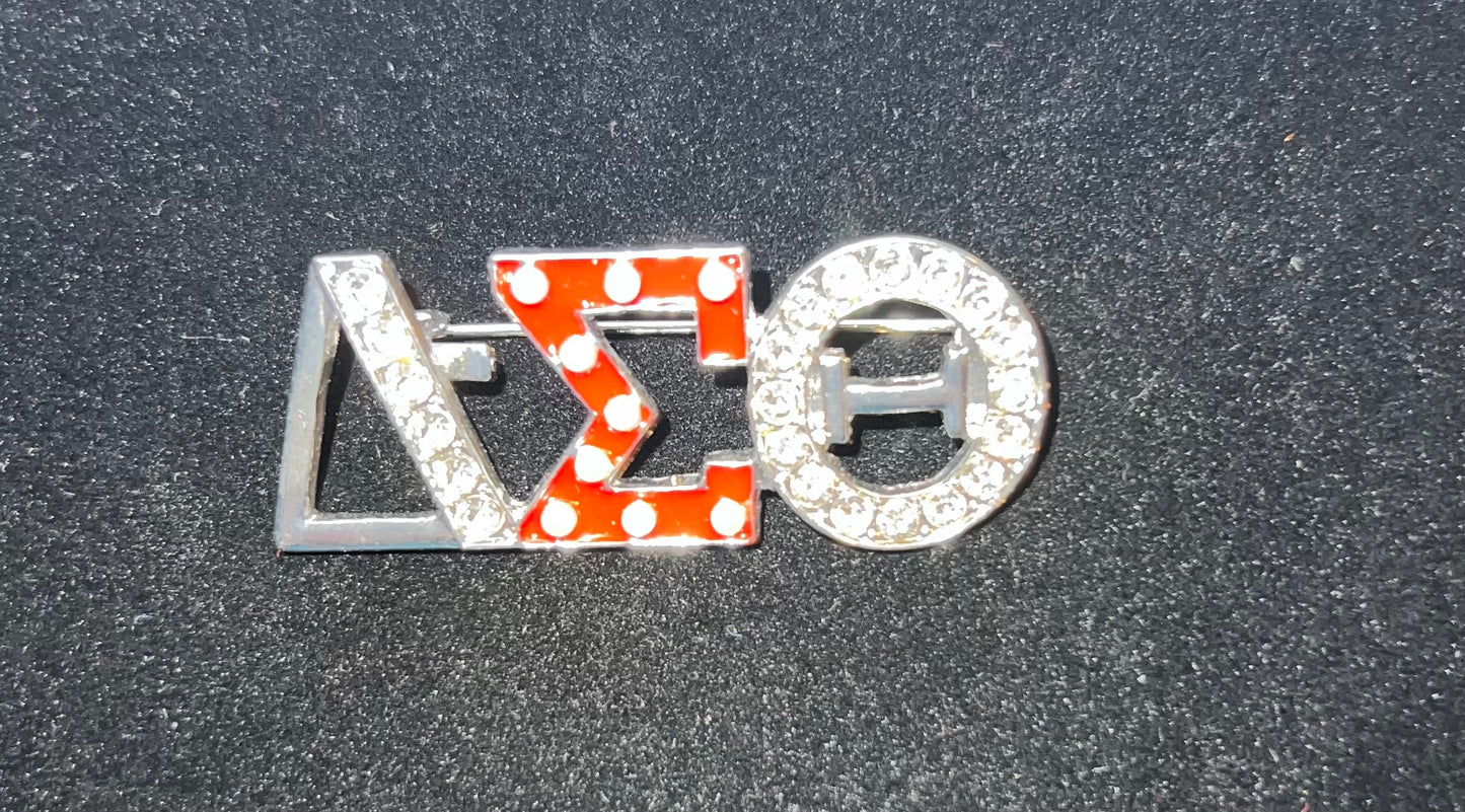 Delta Sigma Theta silvertone brooch W/rhinestones.